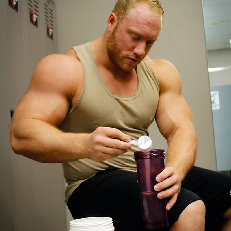 Man adding powder into shaker