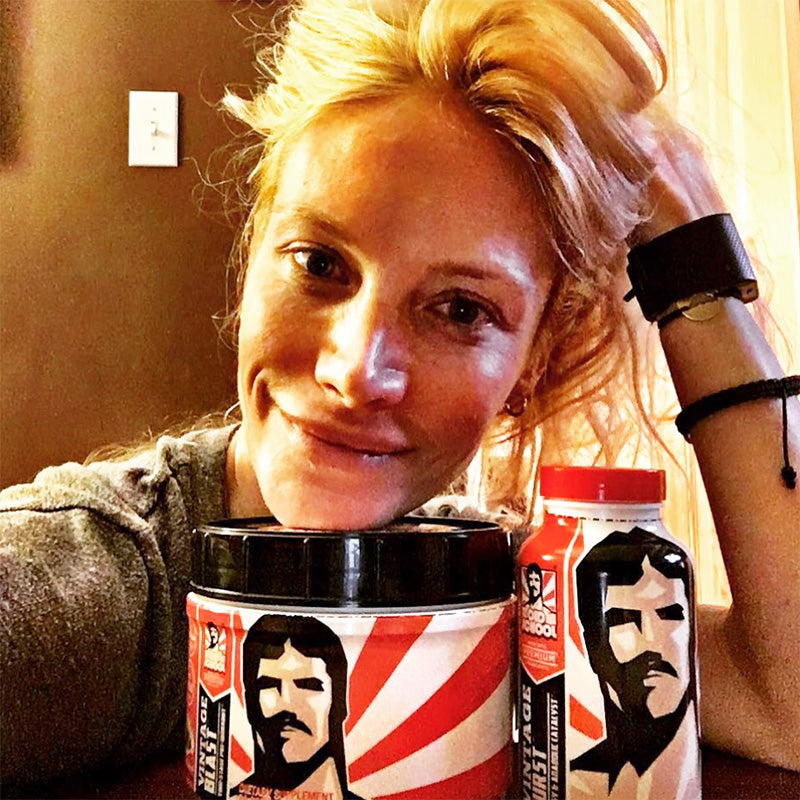 Woman with bottle of Vintage Blast