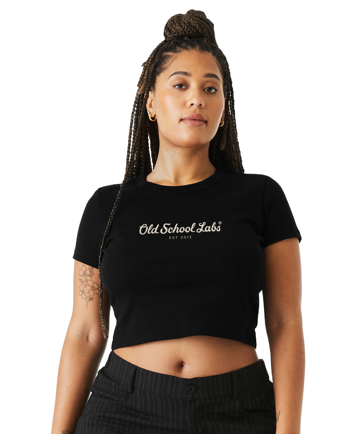 Woman wearing a black crop top with 'Old School Labs' logo