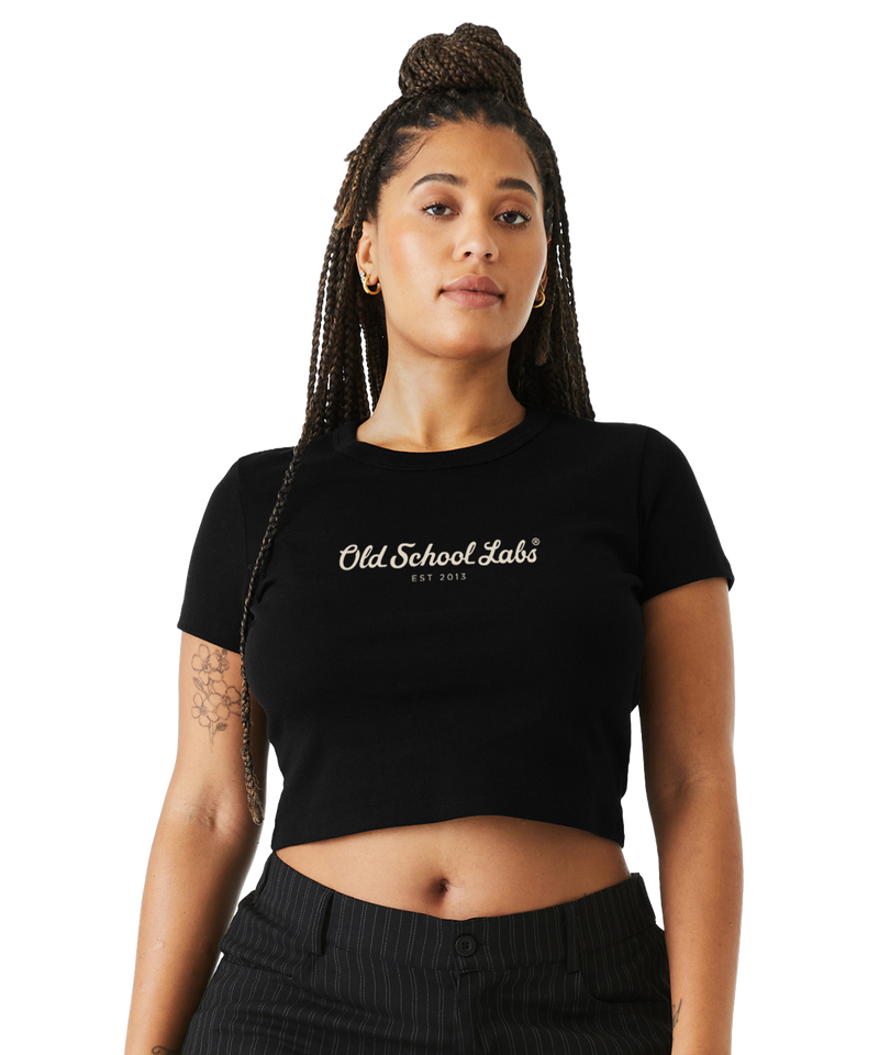 Woman wearing a black crop top with 'Old School Labs' logo