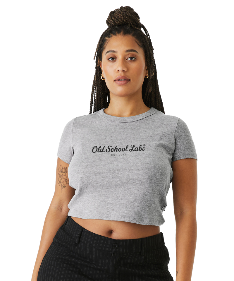 Woman wearing a grey crop top with 'Old School Labs' logo