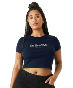 Woman wearing a navy crop top with 'Old School Labs' logo