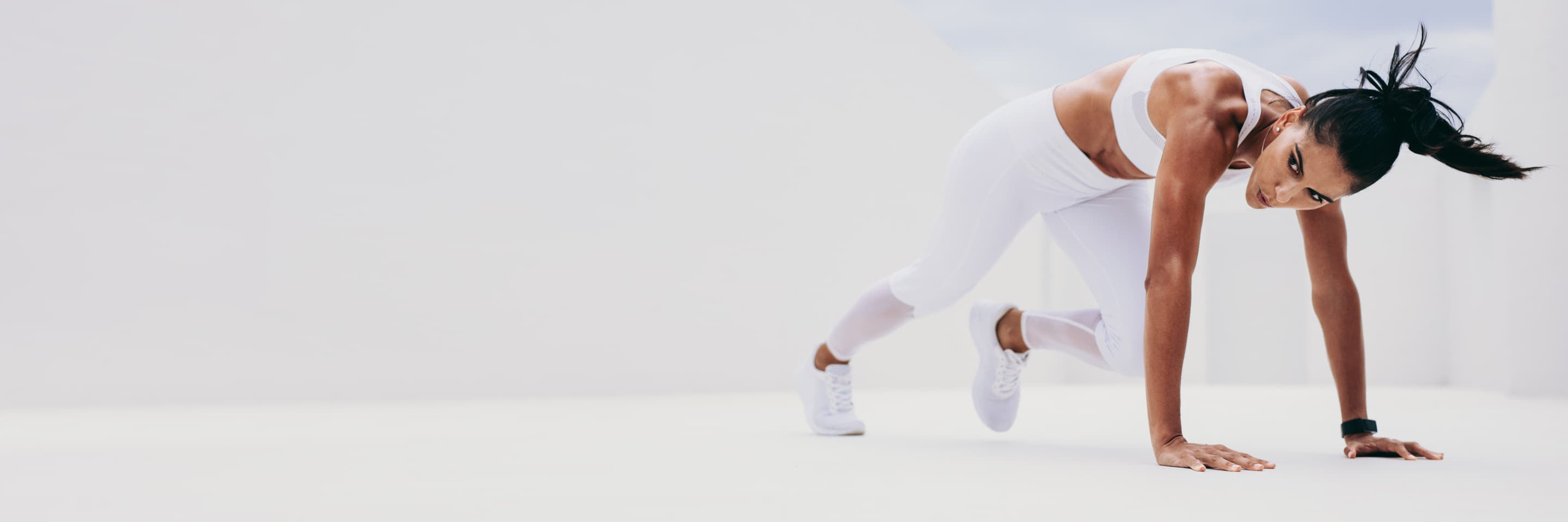 Woman exercising in white